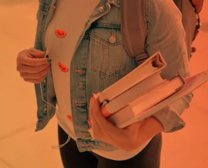 Someone holding books