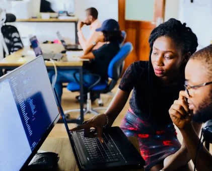 2 people looking at computer screen